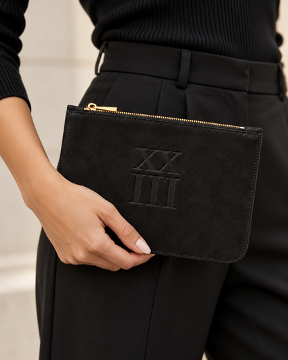 XXIII Audrey Zip Pouch in Black Suede, handheld lifestyle view
